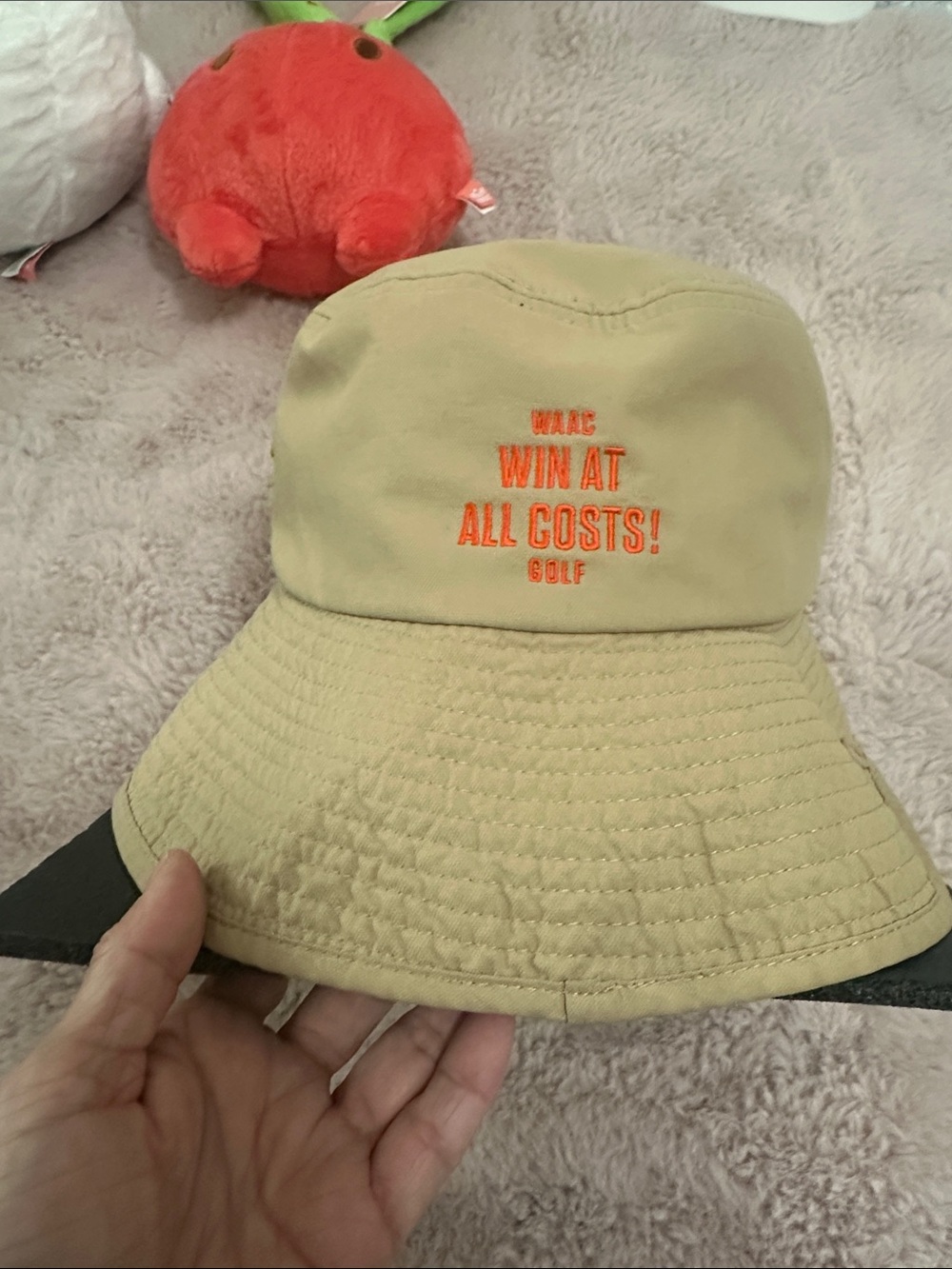 WAAC Beige Bucket Hat with Orange 'WIN AT ALL COSTS Golf Embroidery